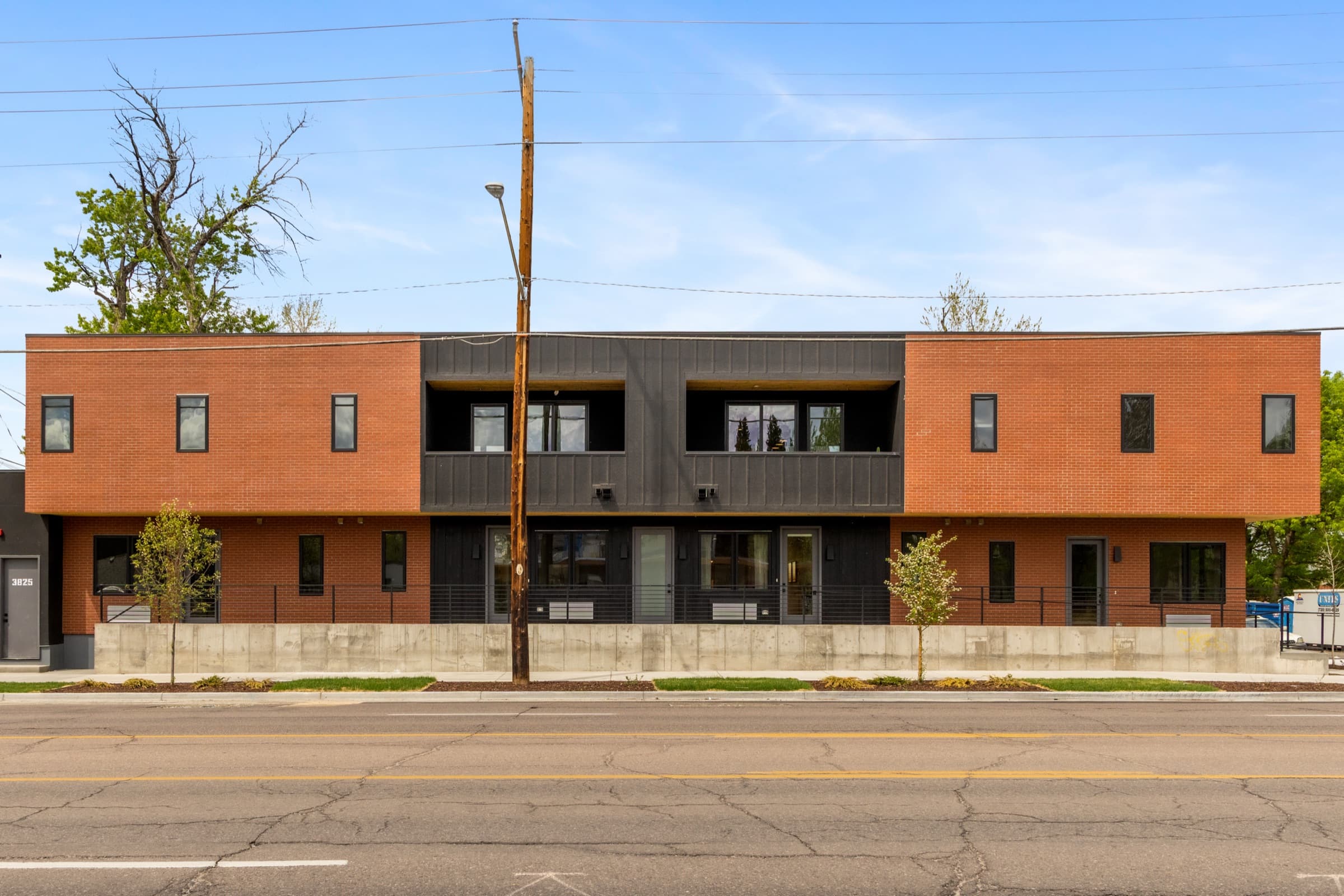 Wide street view of the building's full facade