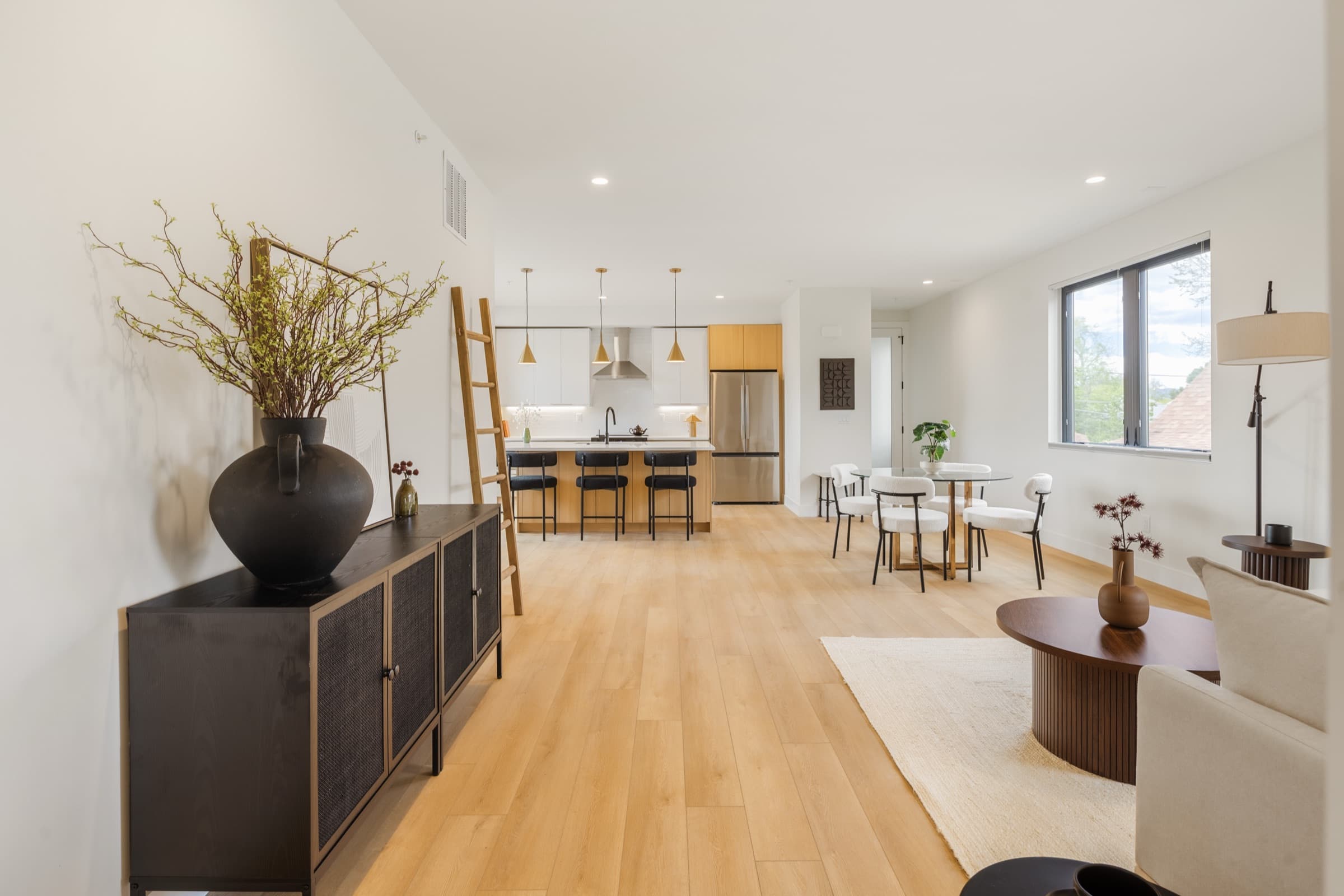 Wide view of the living, dining and kitchen area